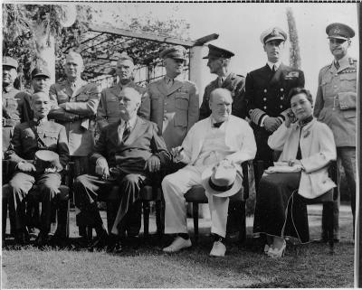 Photograph, Cairo Conference in Cairo, Egypt, 25 November 1943. Seated in the picture (from left to right) are Chiang kai-Shek, F.D.R., Winston Churchill, Madame Chiang kai-Shek.