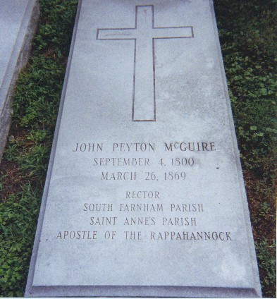 Picture of John Peyton McGuire’s grave with cross at top.