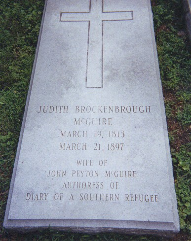 Picture of Judith McGuire's grave with cross at top.
